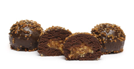 Chocolate truffles with caramel filling and peanut flavor isolated on white background