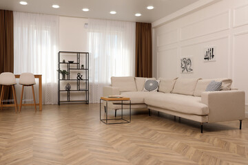 Fototapeta na wymiar Modern living room with parquet flooring and stylish furniture