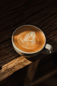coffee latte art on wooden table