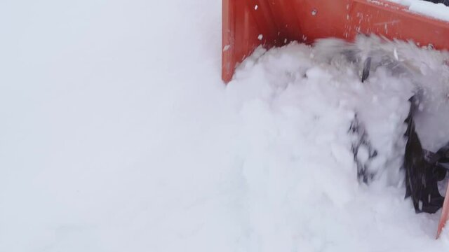 Snow blower auger rotation close up in slow motion