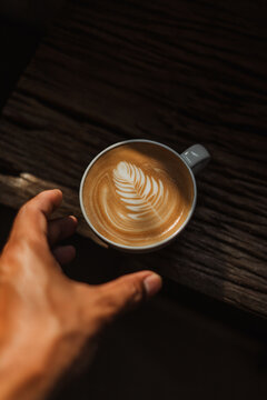 coffee latte art on wooden table