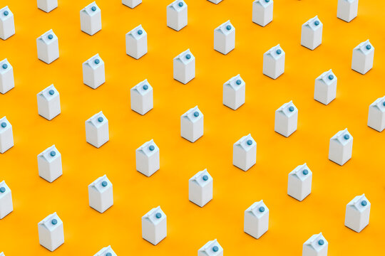 pattern of blue packaging containers on orange background