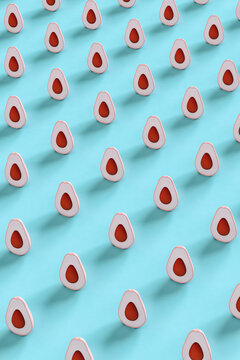 pattern of Pink avocados on blue background