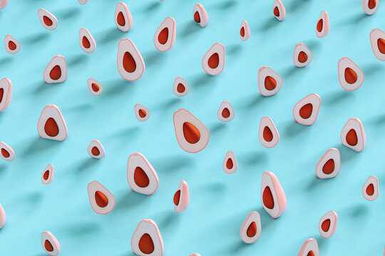 Pink avocados on blue background