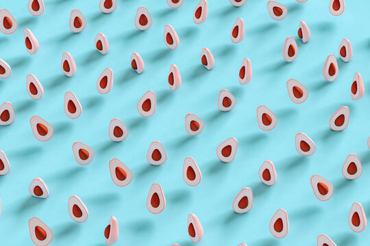Pink avocados on blue background