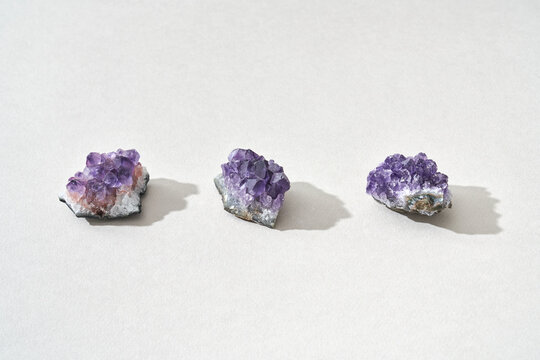 Three healing magic amethyst crystals - Powered by Adobe