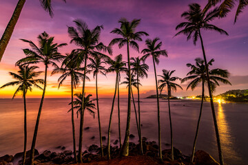 Fototapeta na wymiar Sunset at the tropical beach of Coconut Tree Hill, Sri Lanka in the eve of 2019