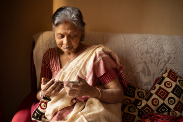Active senior browsing internet with smartphone