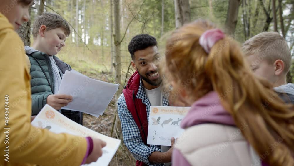 Poster african-american teachers with group of small children outdoors in nature, learning group education 