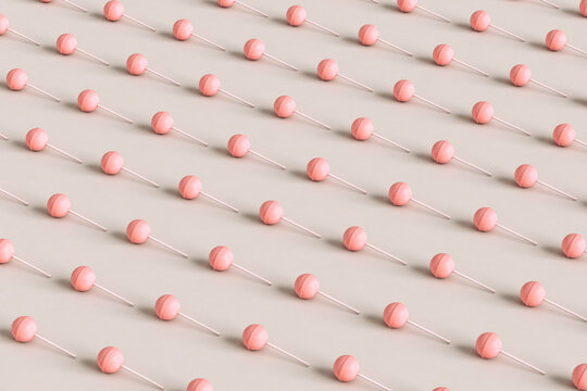 Pink lollipop on pink background