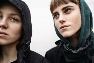 Two young women in hoods