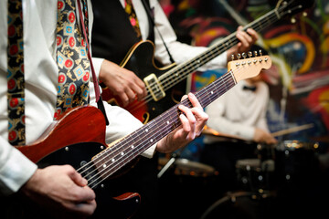 Fototapeta premium Guitars during a concert. Guitarists on a stage.