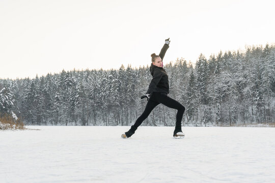 Figure Skater Skating At Frozen Lake