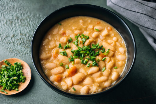 White beans soup topped with chives