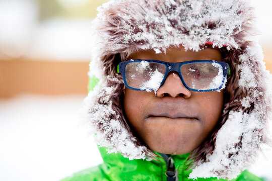 Black Boy With Snow Covered Glasses