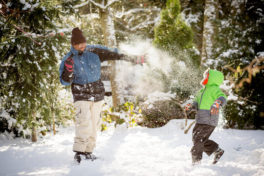 Father and son in snowball fight