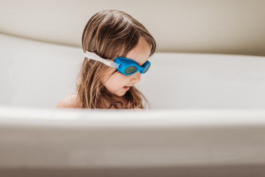 Girl with goggles enjoying bath