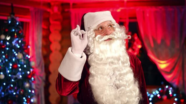 Portrait of bearded Santa Claus. Santa clause standing in specially decorated room