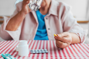 An Old Lady Taking Her Medicines 