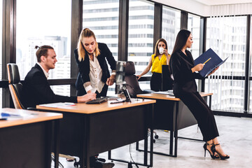 Two professional business man and woman meeting and discussing strategy with new startup project.Creative business people planning and brainstorm in modern office.Teamwork