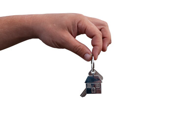 Guy holds the keys to the house in his hands isolated on the white background. Concept on the topic of buying a new home.