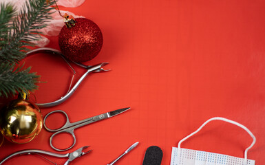 manicure and new year. Tools for manicure on a red background