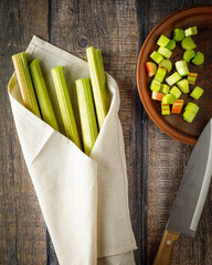 still life with fresh organic rhubarb on wooden background