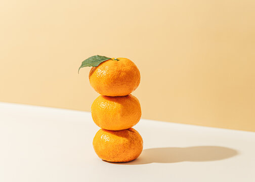 Stack of mandarin oranges with leaf