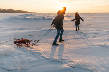 couple having fun with a sled