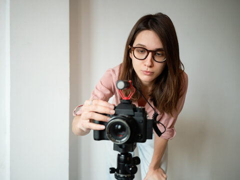 Woman recording video at home