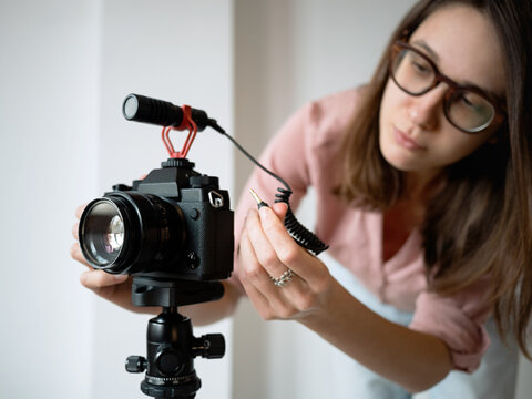 Woman recording video at home