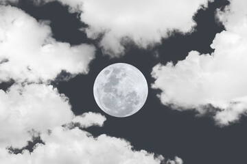 Naklejka na ściany i meble Full moon between clouds on the sky.