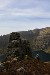 Fototapeta na wymiar huge rock on a mountain with a bottom lake in a valley. Comeragh Mountains, Waterford, Ireland