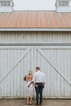 Flirty Bride and Groom Squeezing Each Other's Butts at Wedding