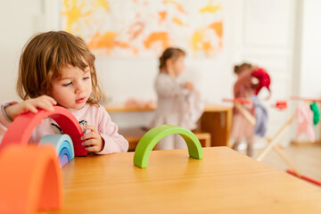 Children playing at the table