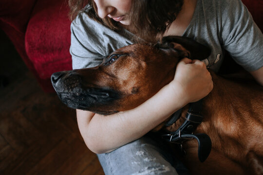 Portrait of a woman with a large dog.