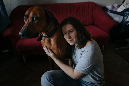 Portrait of a woman with a large dog.