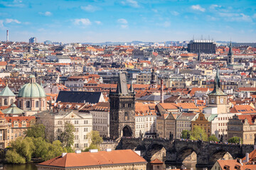 Fototapeta na wymiar Prague cityscape - shot taken from Prague castle overlooking part of Charles Bridge and Old Town and New Town