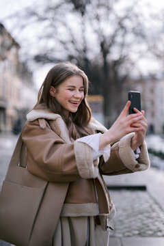 Happy girl taking photo 