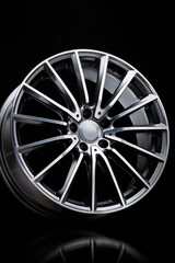 sport alloy wheel, vertical photo on a black background