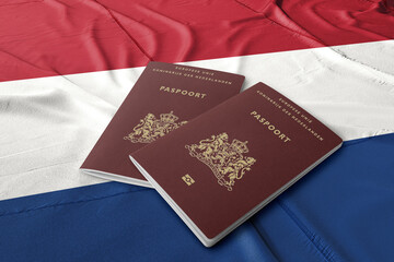Netherlands passport on the Dutch flag ,Dutch passports are issued to citizens of the Kingdom of the Netherlands for the purpose of international travel.
