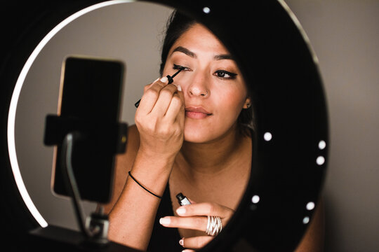 Woman teaching about make up on social media