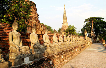 Fototapeta na wymiar Buddha statue and archaeological site in Ancient archaeological site at Ayutthaya., Historical Park of Thailand.