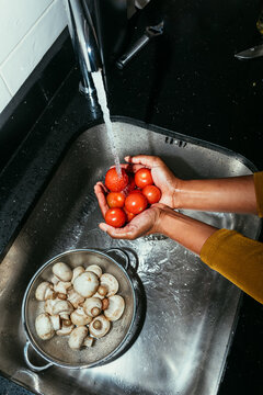 Woman Washing Tomatoes  
