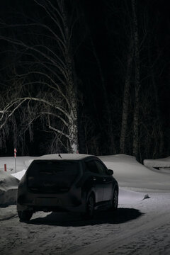 Car parked in snowy countryside