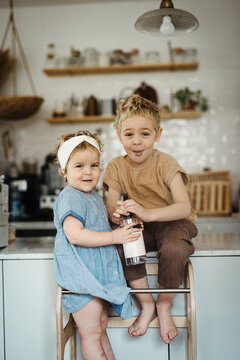 Siblings helping out with house chores and cleaning