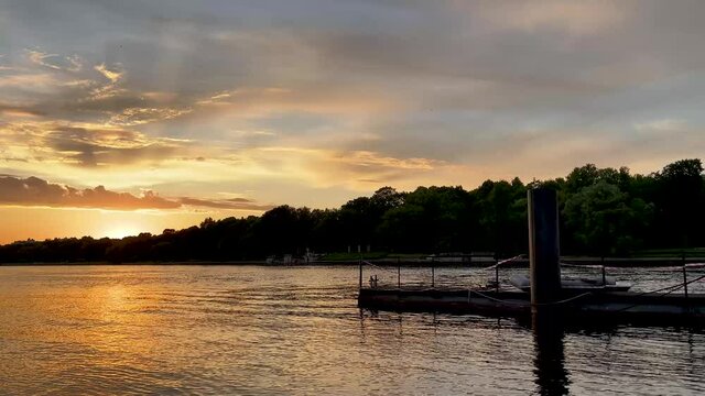 The river bank at sunset in summer. Summer landscape on the river bank. 4K video.