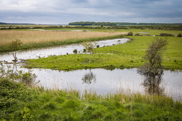 Reflections on the river at Burnham Overy Staithe, Norfolk, England