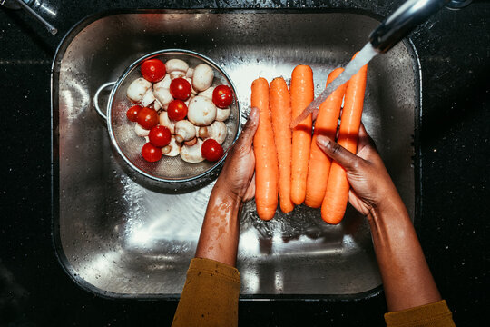 Woman Washing Carrots
