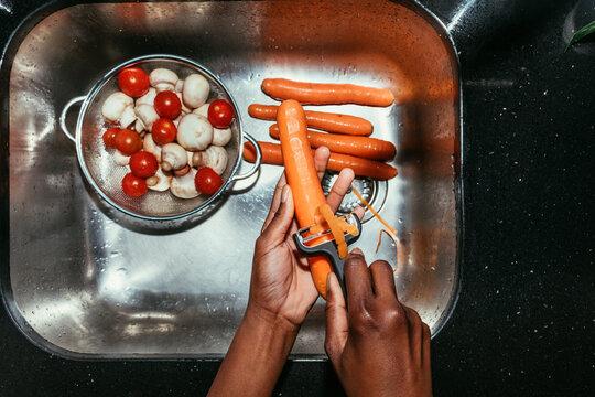 Woman Peeling a Carrot
